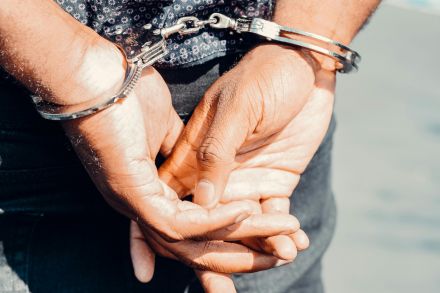 Close Up Photography of Person in Handcuffs